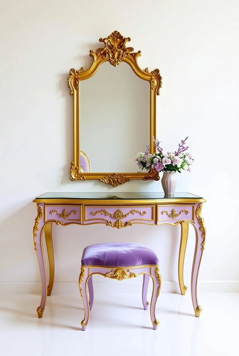 Elaborate Rococo vanity console table with hand-carved gold leaf accents, a matching ornate wall mirror, and an upholstered velvet stool