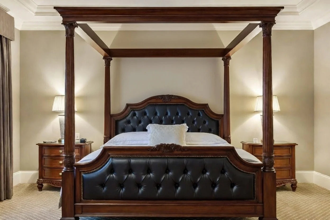 Luxury canopy bed in traditional regency style, handcrafted from solid teak wood with a black button-tufted leather headboard and footboard.