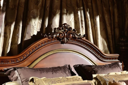 Close-up of carved Victorian bed headboard, ornate solid wood crest detail on luxury traditional poster bed