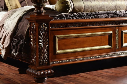 Close-up of Victorian carved footboard panel, solid wood luxury poster bed with traditional detailing