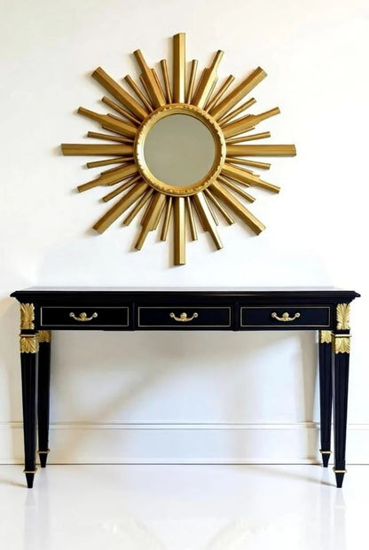 Black lacquer console table with gold acanthus leaf details and oversized sunburst starburst mirror – French Empire Hollywood Regency entryway piece