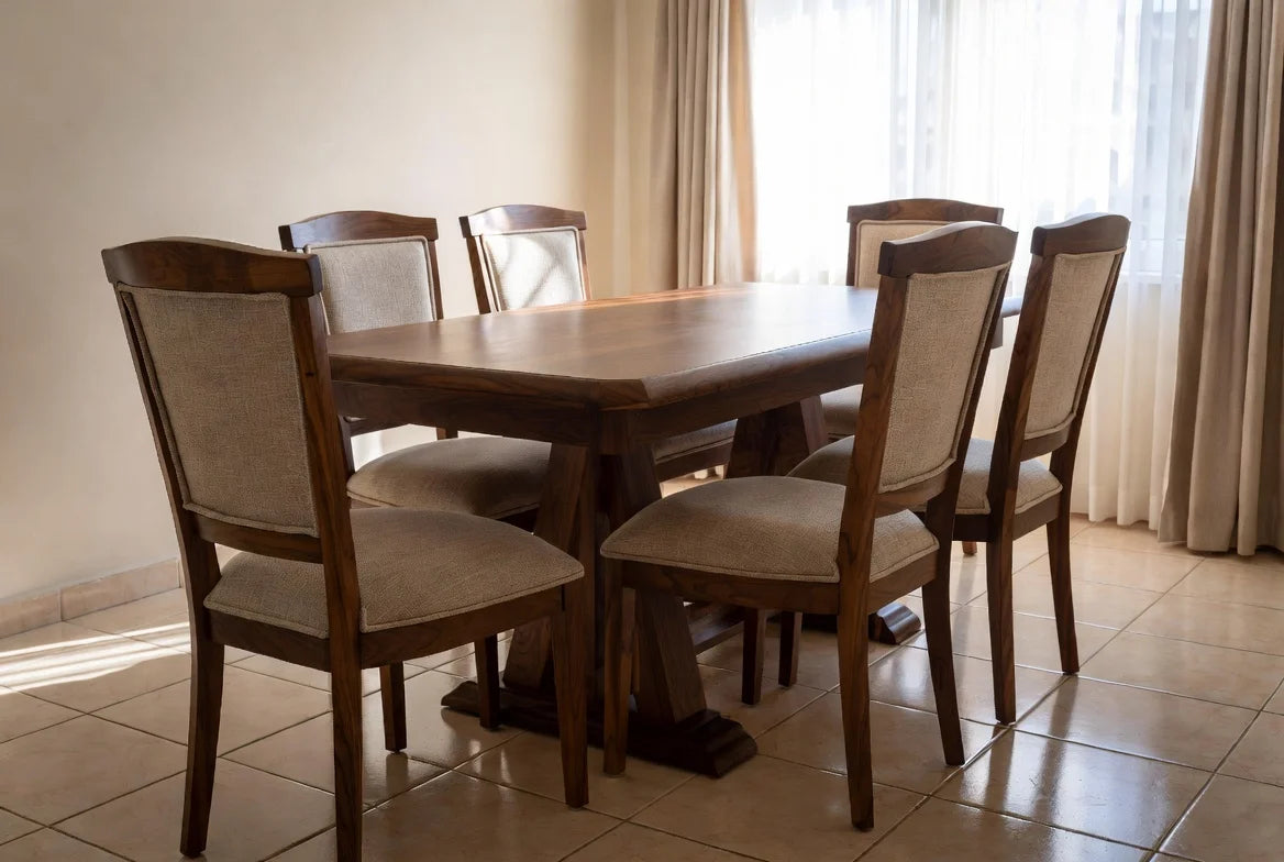 Elegant rectangular walnut dining table with bold trestle legs and 6 matching high-back chairs in craftsman style, modern farmhouse dining room