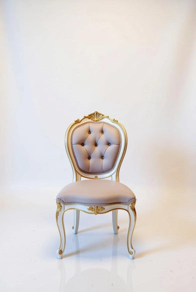Cream white and gold French Baroque dining chair with tufted beige upholstery, ornate carved back, and gilded armrests – Louis XV style luxury armchair