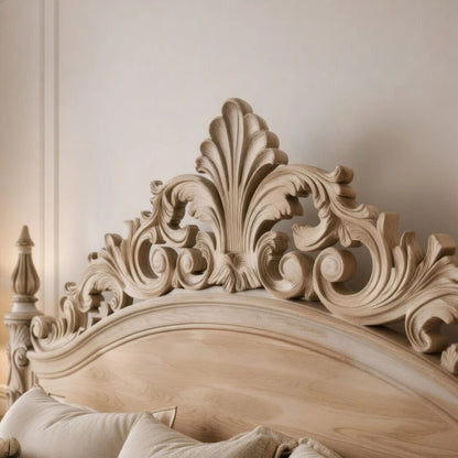 Close-up of ornate handcarved wood headboard on luxury floating bed frame with detailed craftsmanship
