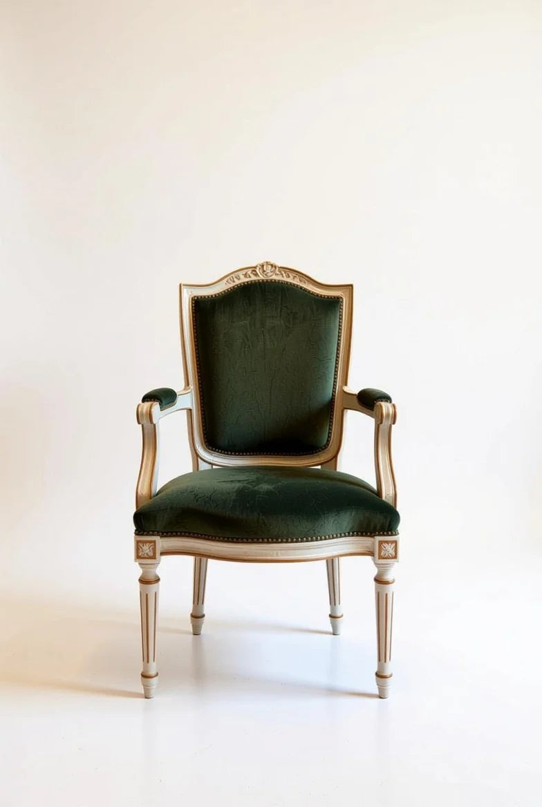 French Empire dining armchair in deep emerald green velvet with ornate hand-carved gold leaf frame, cabriole legs, and regal rococo design