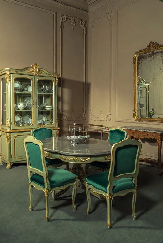 Luxury French Louis XV sage green dining set with marble round table, emerald velvet chairs, gold leaf carvings, and matching rococo cabinet