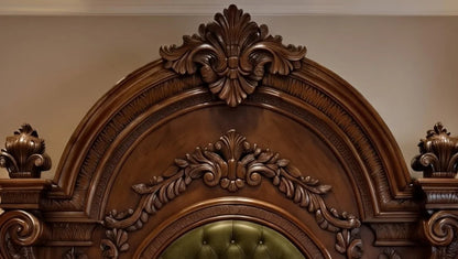 Close-up of intricate hand-carved floral details on the massive wooden headboard of the Maharaja round bed