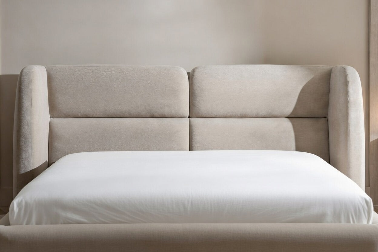Close-up of curved wingback headboard on modern upholstered shelter bed, premium fabric contemporary bed frame detail