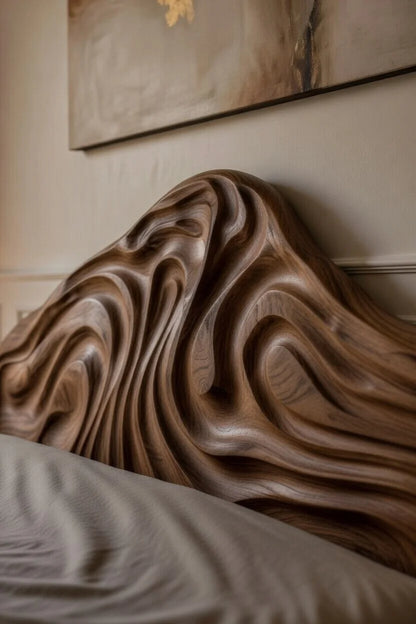 Close-up of sculpted organic wood headboard with flowing carved grain on a natural floating platform bed frame