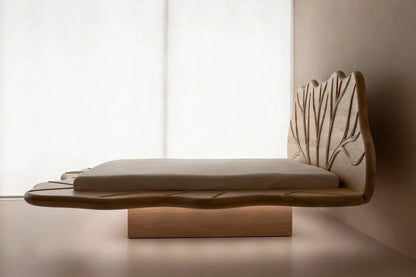 Side view of low profile floating bed frame in solid wood showing suspended platform base design