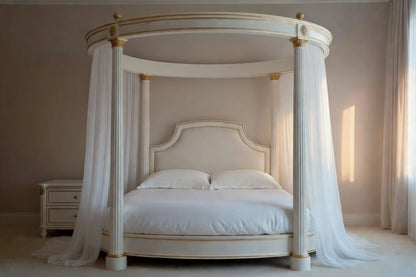 Four-poster bed with canopy and white bedding in a bedroom setting.