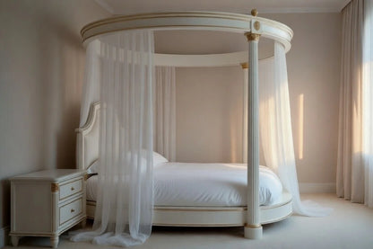 Round canopy bed with white bedding in a softly lit bedroom.