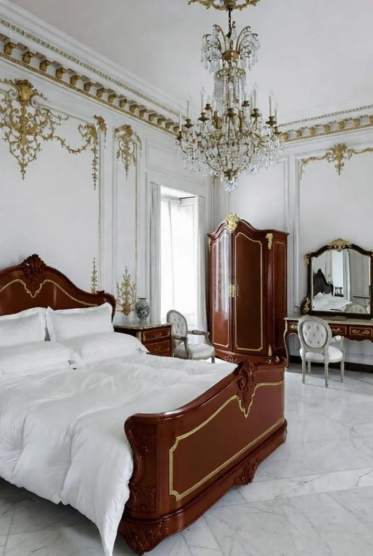 Full view of the Royal French Louis XV bedroom suite featuring a solid mahogany bed with gold accents, matching armoire, and vanity set in a luxurious room