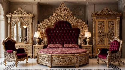 Full view of the Royal Victorian bedroom suite featuring a bright gold round bed with burgundy velvet tufting, peacock-carved wardrobe, and matching vanity