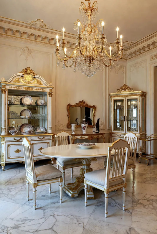 Royal white & gold round dining set in luxurious Empire style with hand-carved pedestal table, ornate gold accents, and matching chairs in opulent palace interior