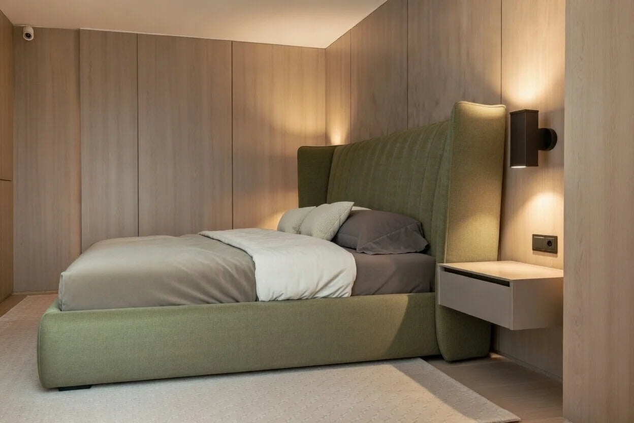 Side view of modern upholstered shelter bed showing solid wood platform base and floating nightstand in contemporary bedroom
